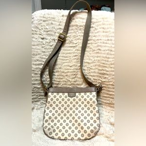 Fossil purse with adjustable strap.